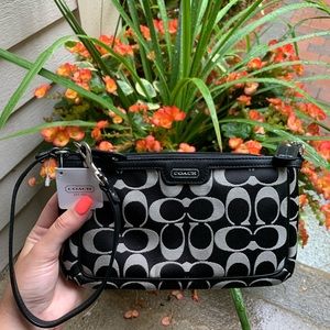 Coach black and white wristlet
